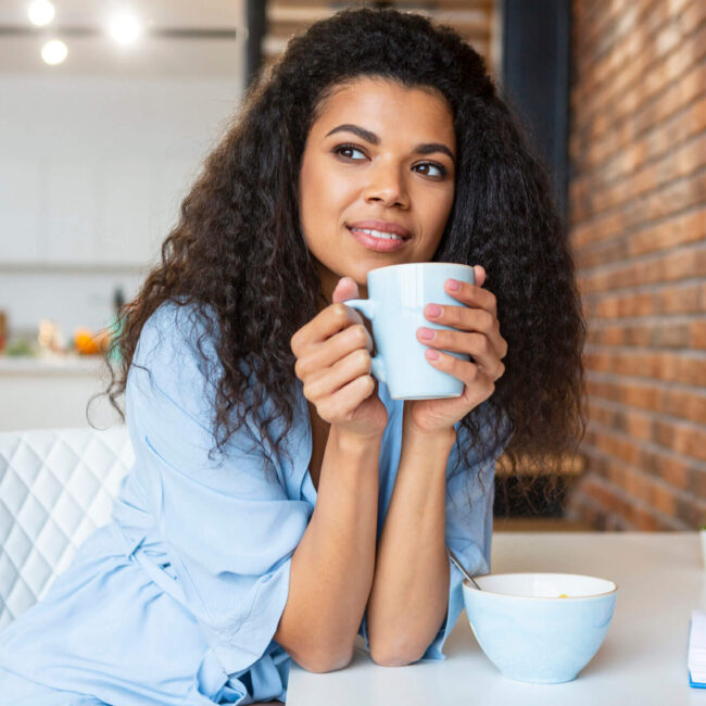 young woman having cup coffee